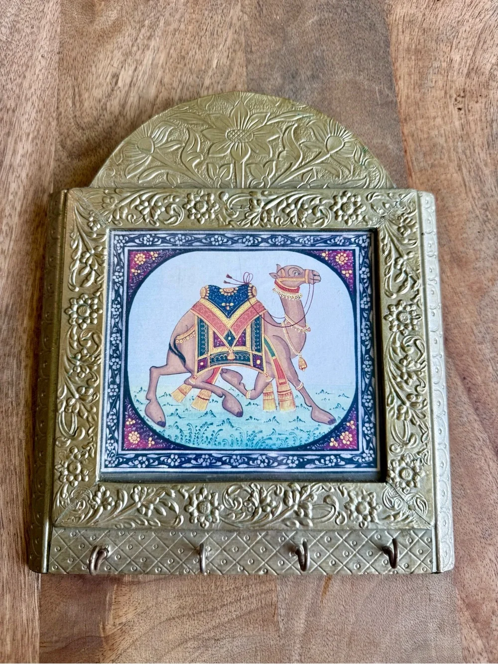 Indian brass-trimmed wall key holder featuring an ornate, miniature-style camel